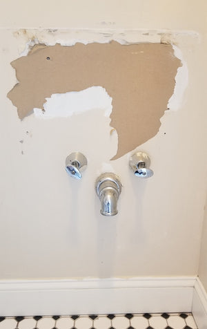 How to cut out wall to install brace for pedestal sink?